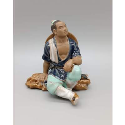 Statuette Mudman Homme Assis