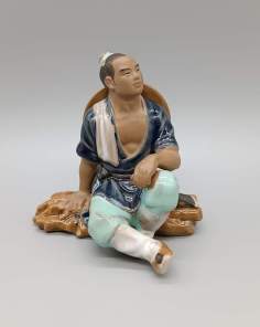 Statuette Mudman Homme Assis